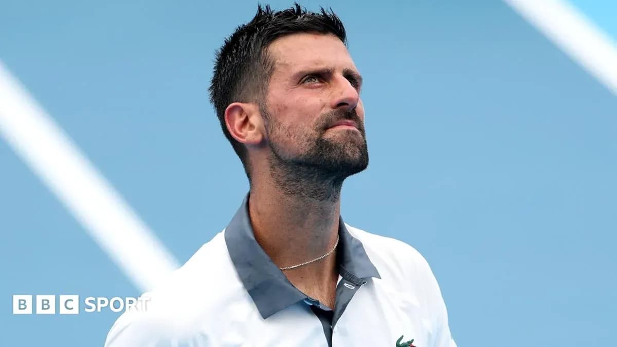 Tennis player looking up during match