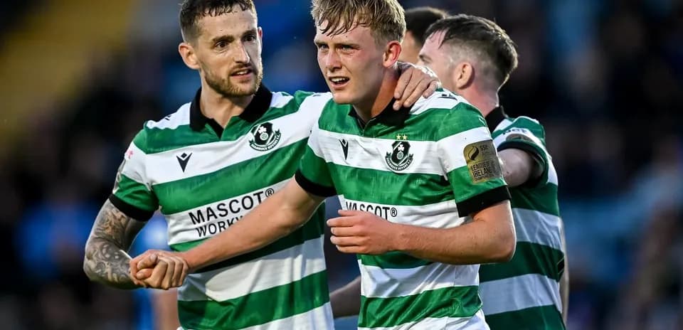 Hibernian FC players celebrating a goal together