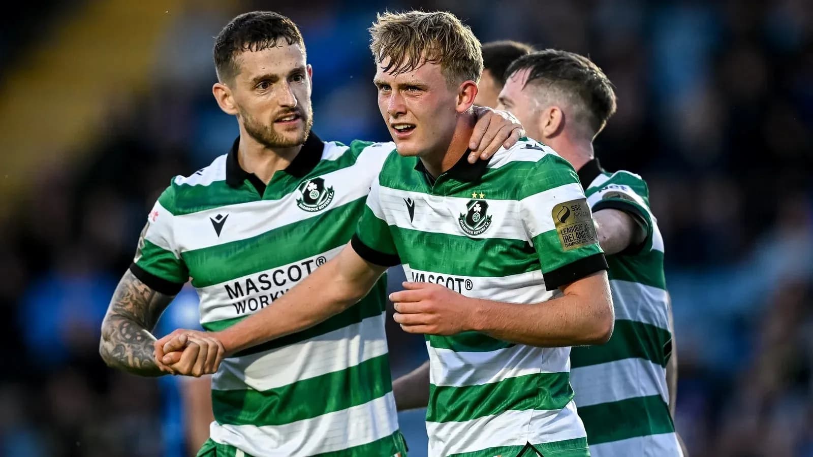 Hibernian FC players celebrating a goal together