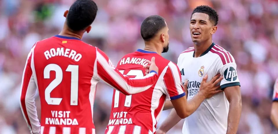 Atletico Madrid players confront Real Madrid player