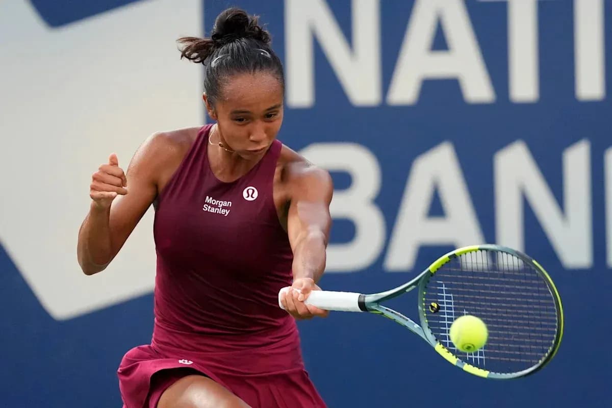 Tennis player hitting a ball during match