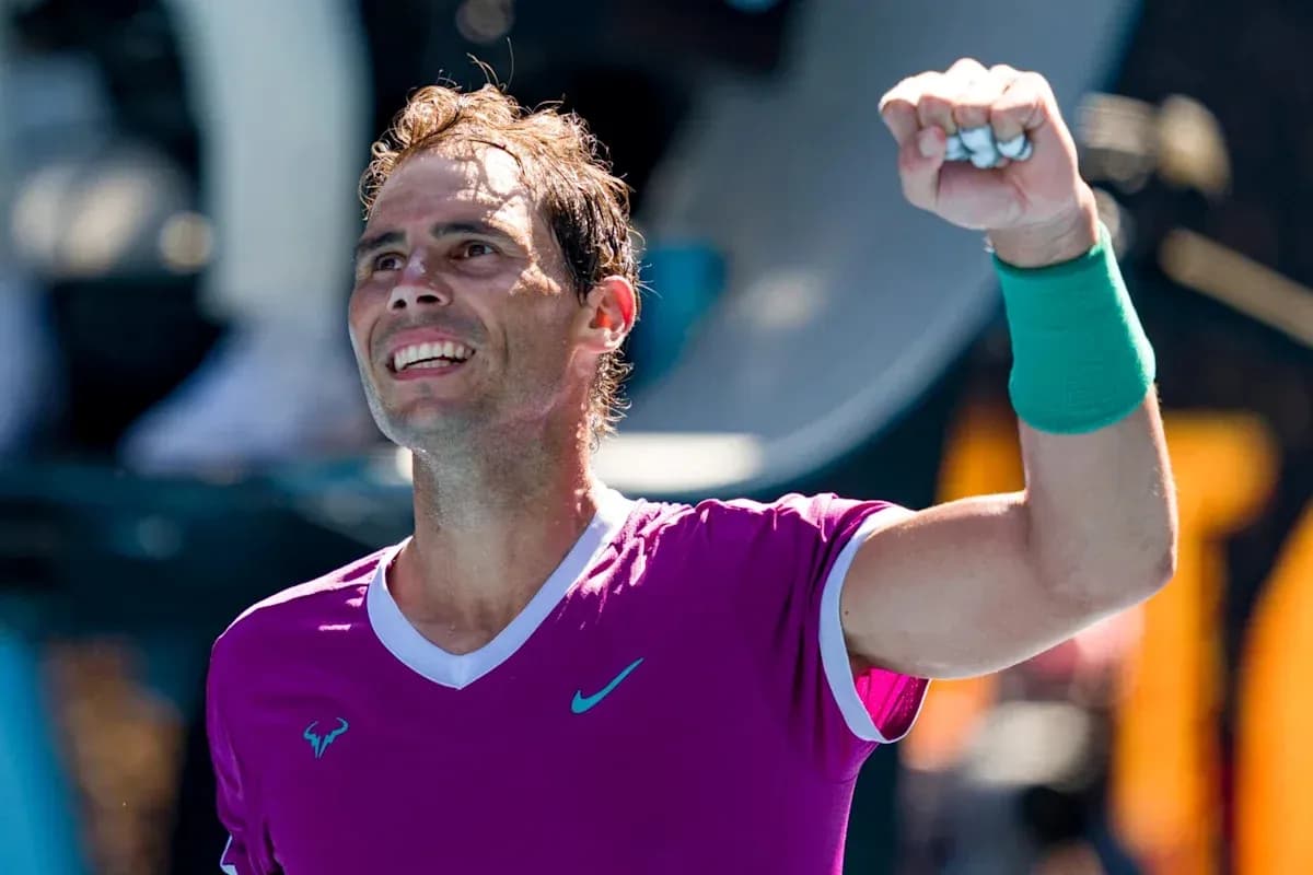 Tennis player celebrating victory with raised fist
