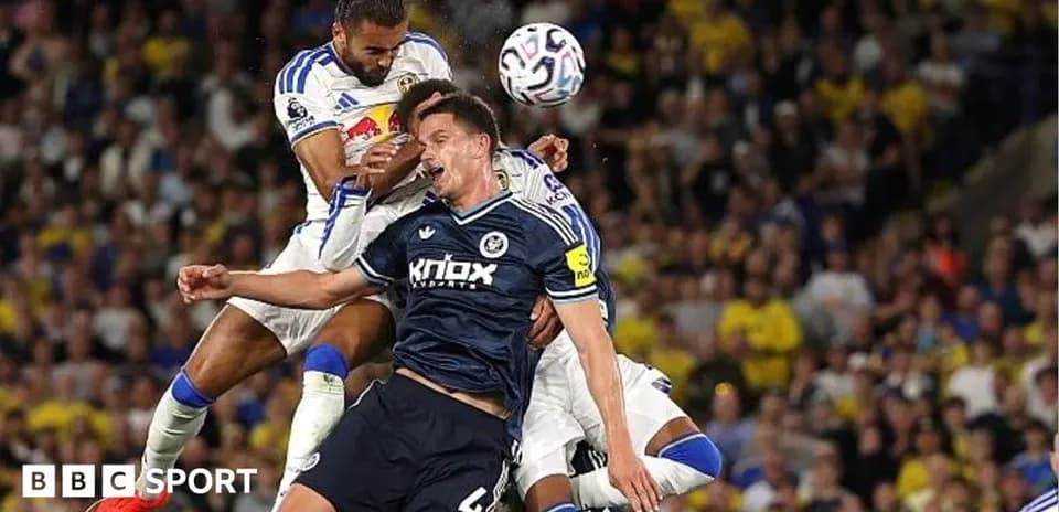 Two players colliding during a football match