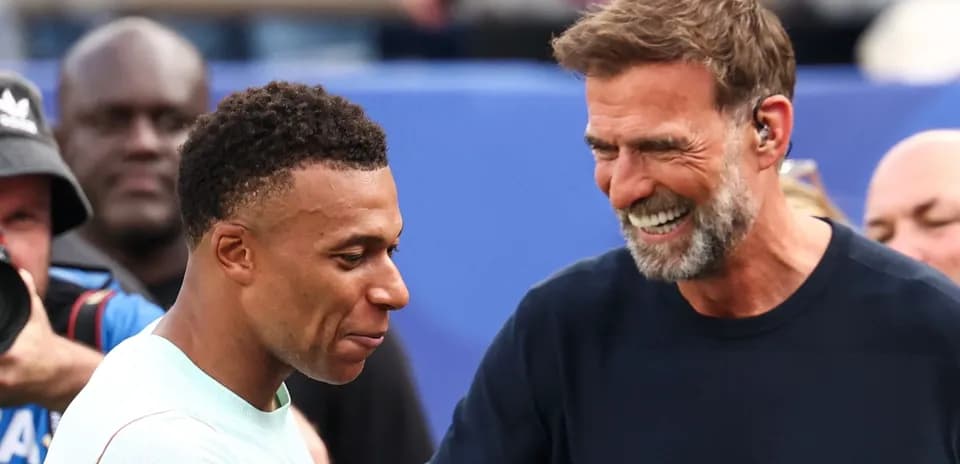 Mbappé and Klopp smiling during an event