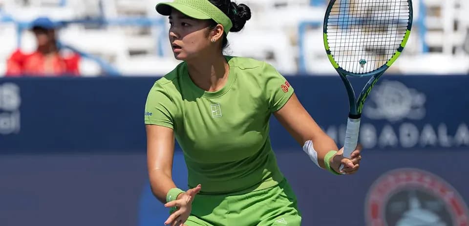 Tennis player preparing to hit a shot on court