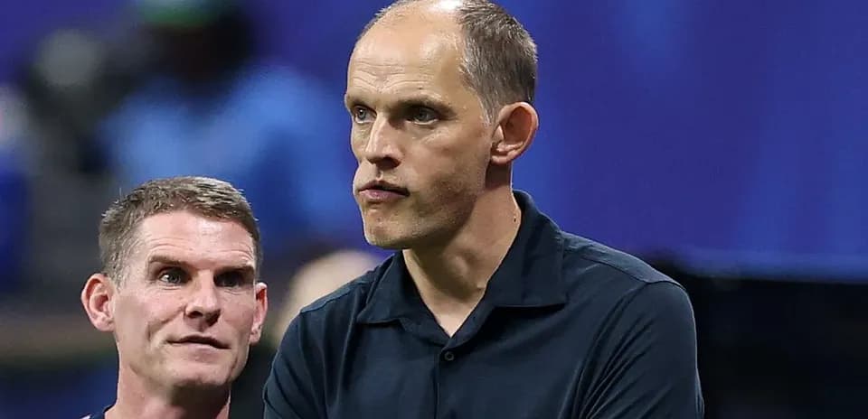 Two coaches discussing during a match