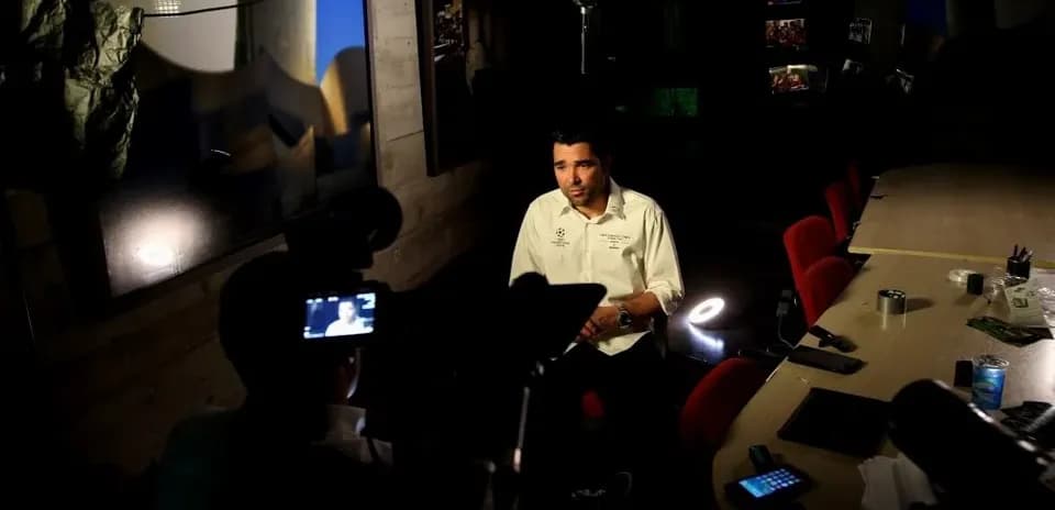 Interviewer speaking during a filmed interview session
