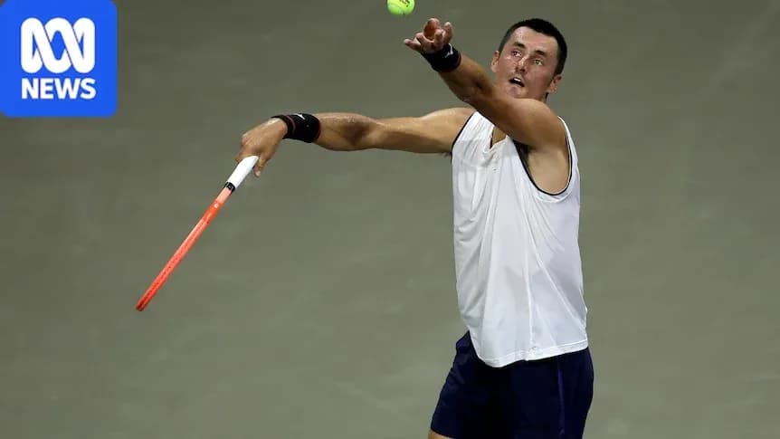Tennis player serving during a match