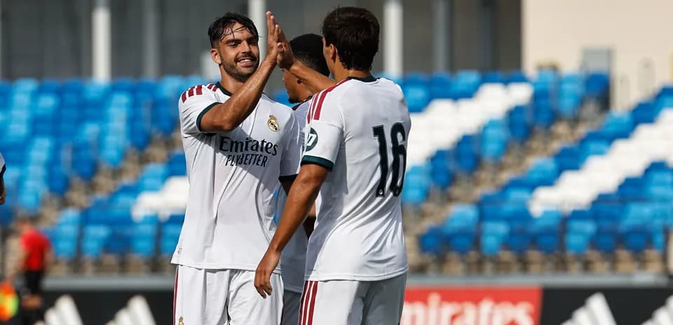 Real Madrid players celebrating a goal together