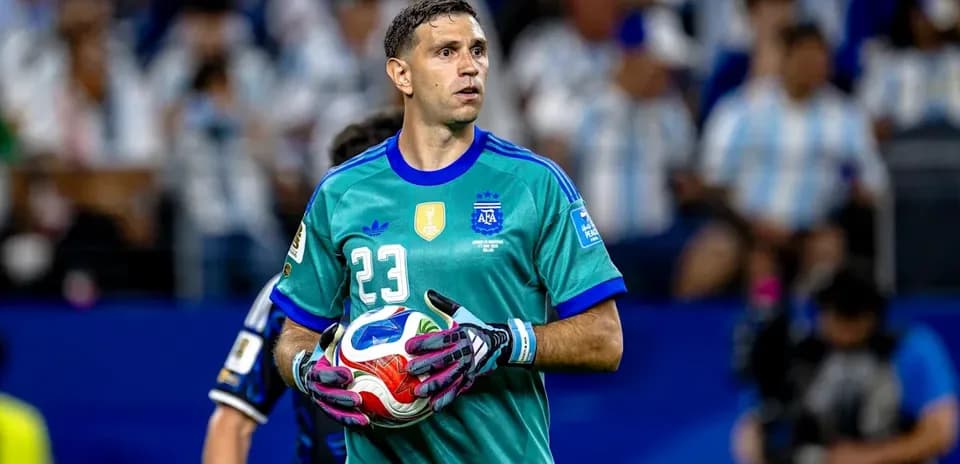 Goalkeeper holding ball during match warm-up