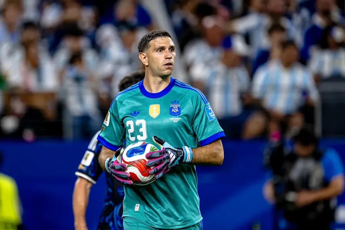 Goalkeeper holding ball during match warm-up