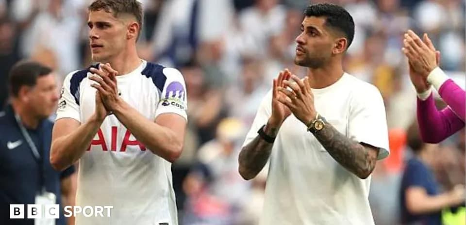 Two players applauding fans after the match