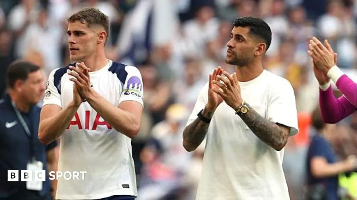 Two players applauding fans after the match