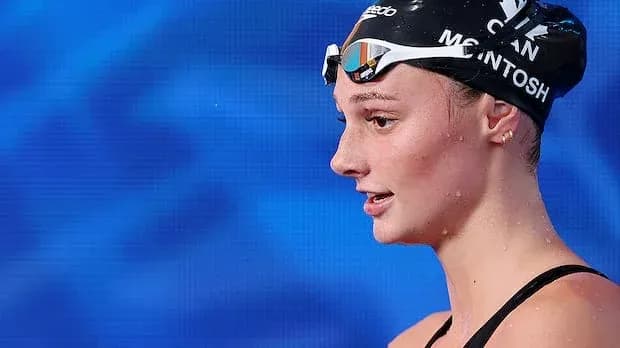 Swan swimmer with goggles and cap at competition