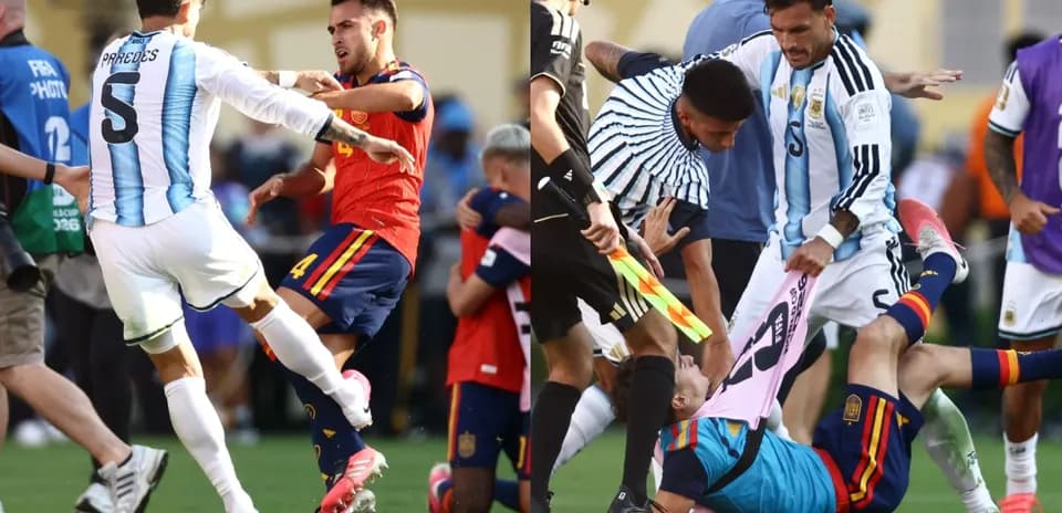Players clashing during intense football match moment