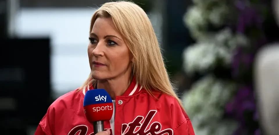 Television presenter speaking into microphone at event