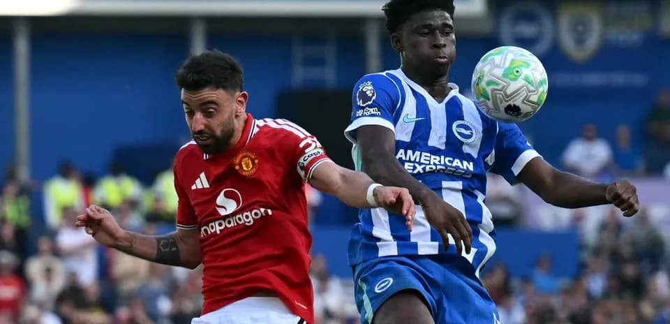 Bruno Fernandes and player contesting ball during match