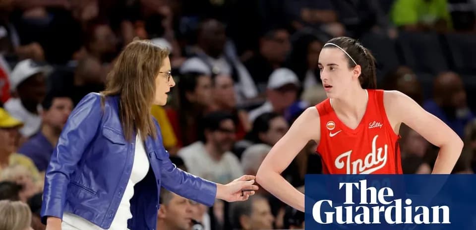 Coach advising player during basketball game
