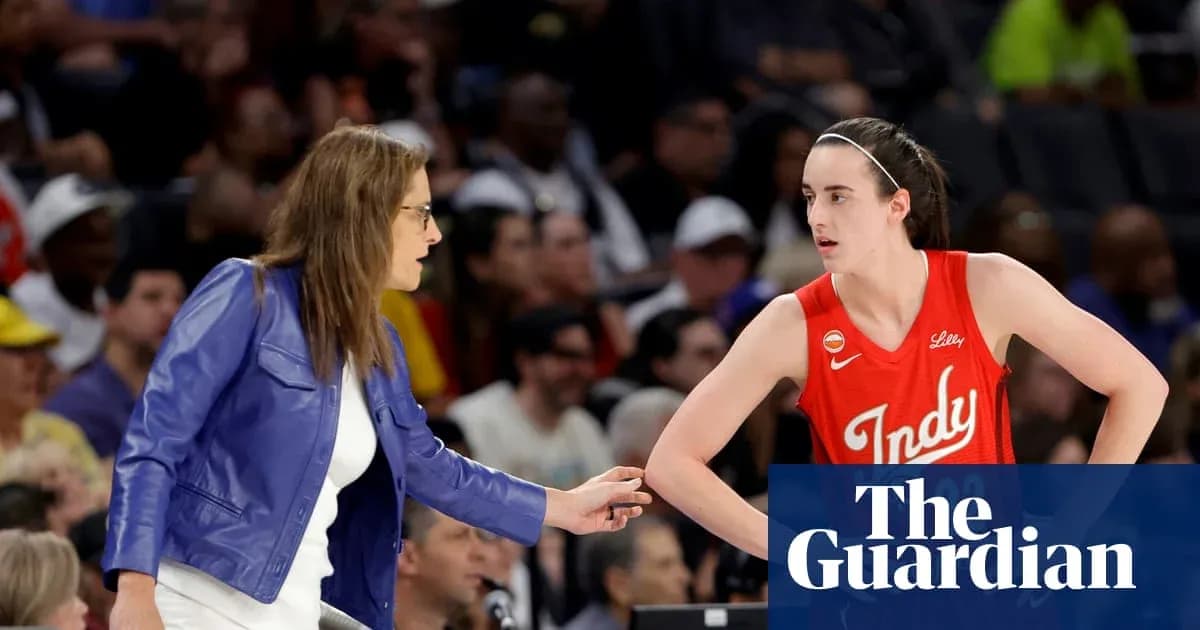 Coach advising player during basketball game