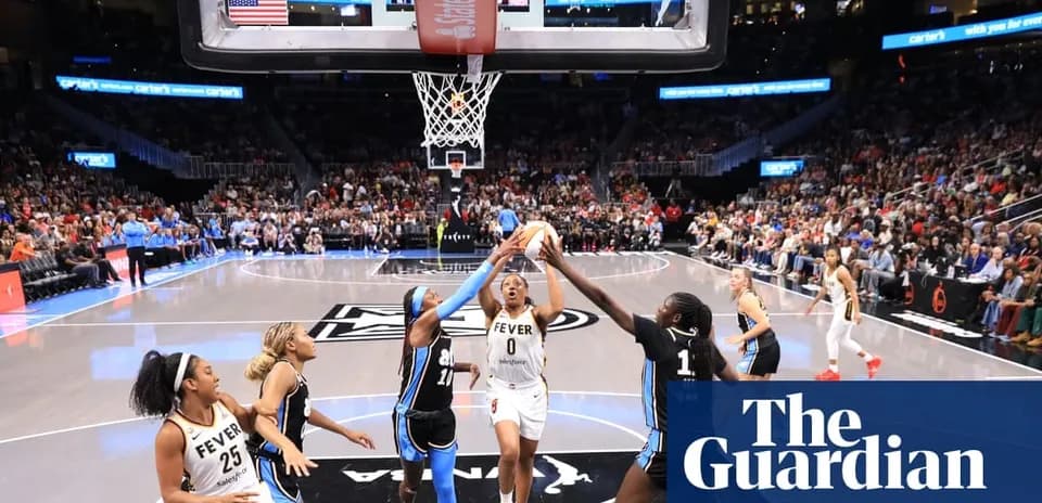 Basketball players contesting for the ball near hoop