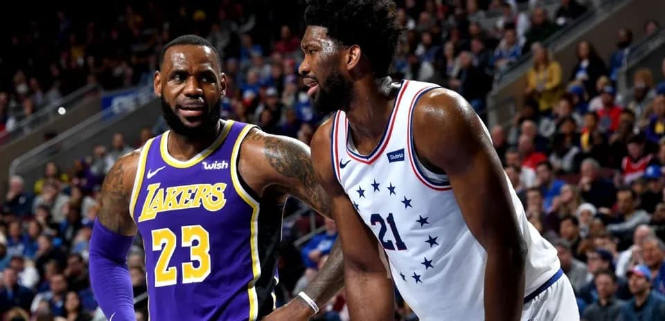 LeBron James and Joel Embiid on the court