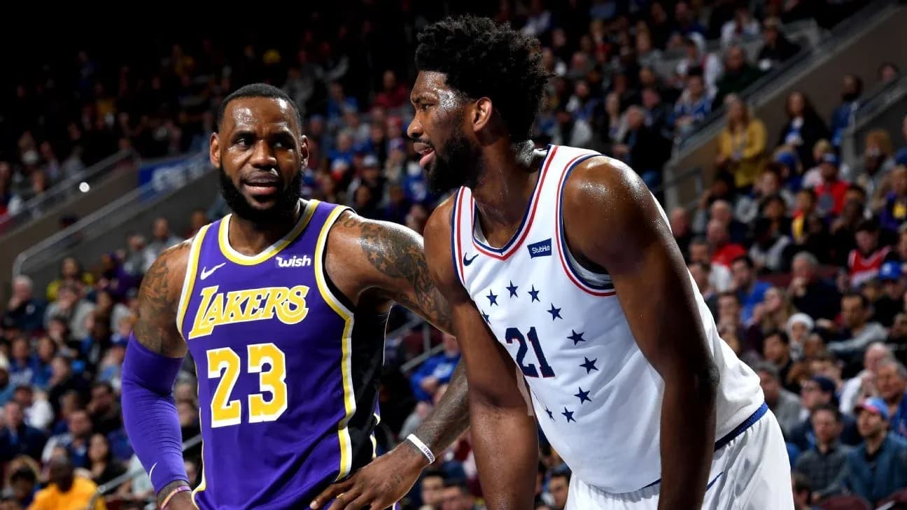 LeBron James and Joel Embiid on the court