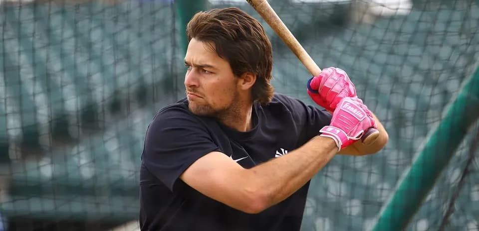 Batter practicing swing during batting practice session