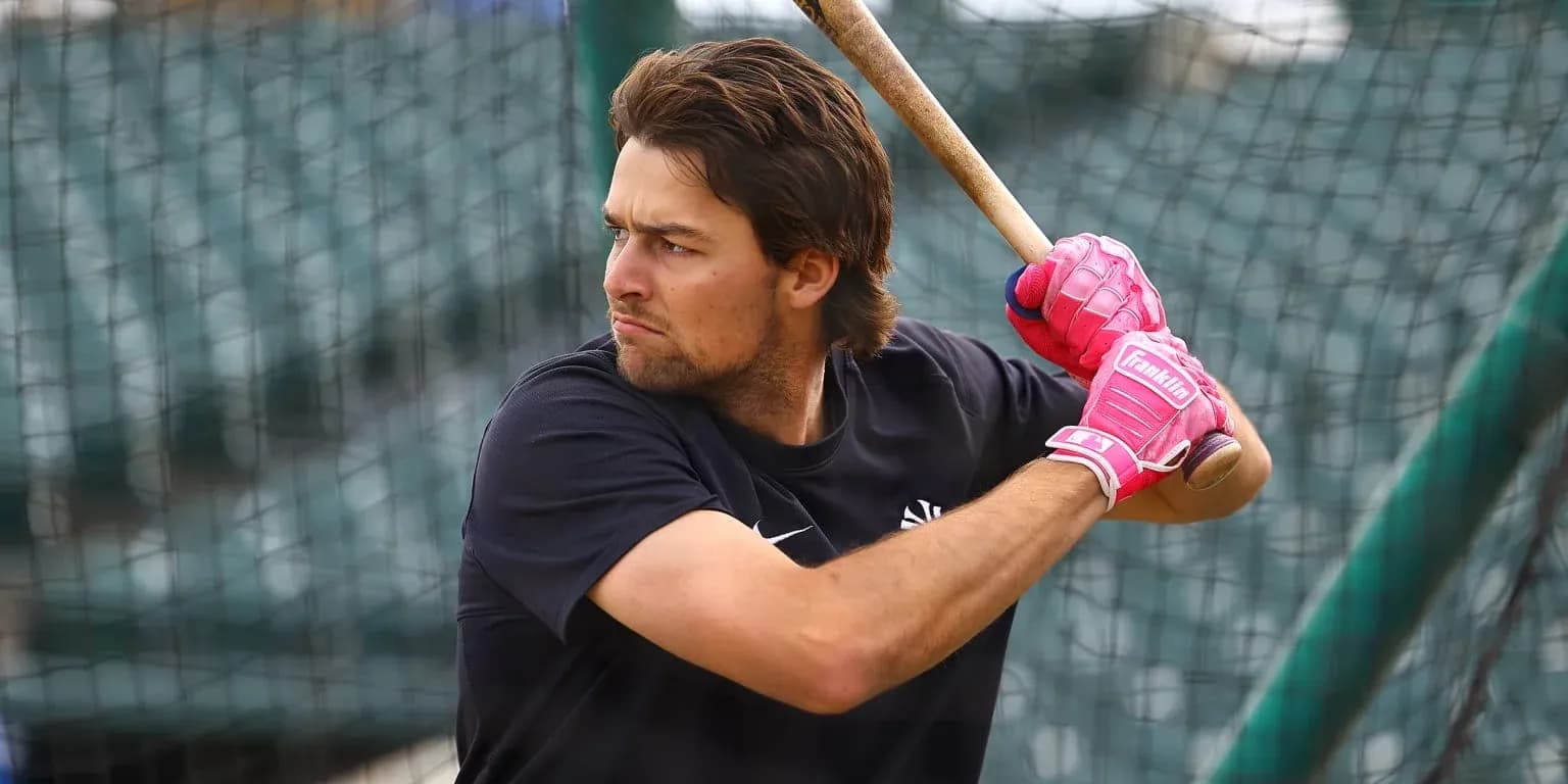 Batter practicing swing during batting practice session
