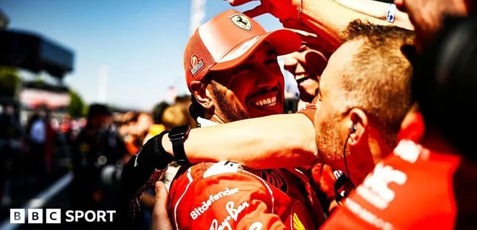 Ferarri team celebrating victory with driver