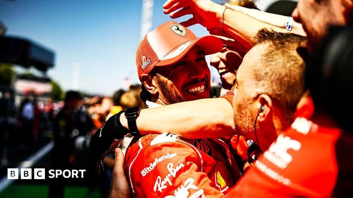 Ferarri team celebrating victory with driver