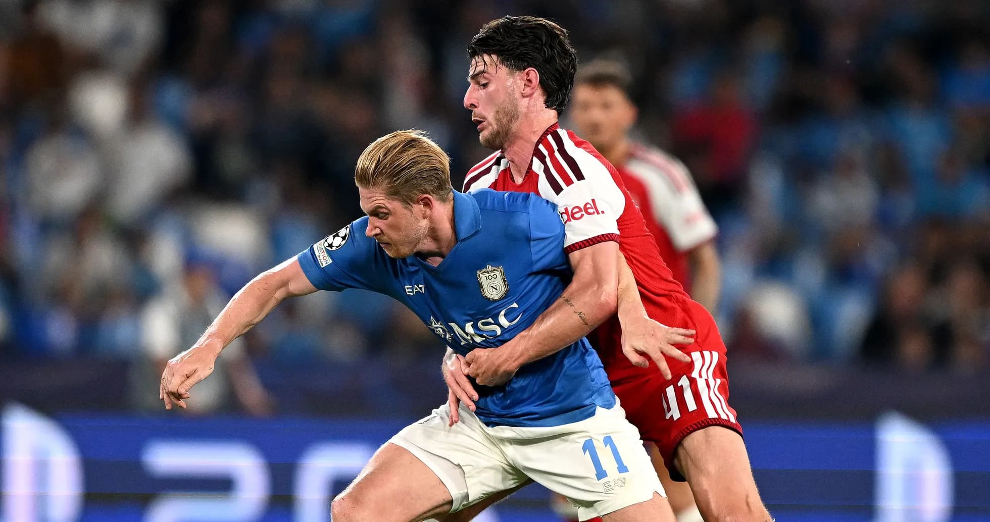 Two players battling for possession during match