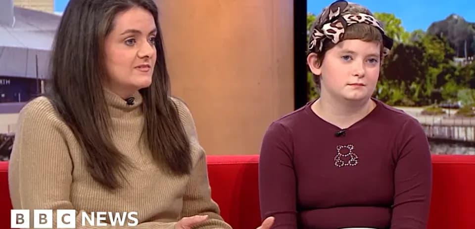 Two women discussing on a talk show set