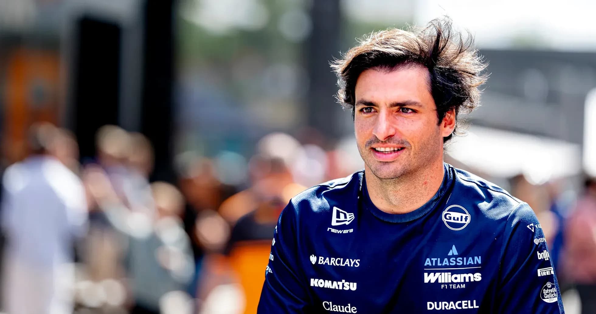 Formula 1 driver in team uniform at event
