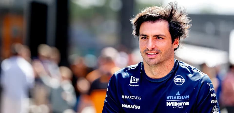 Formula 1 driver in team uniform at event