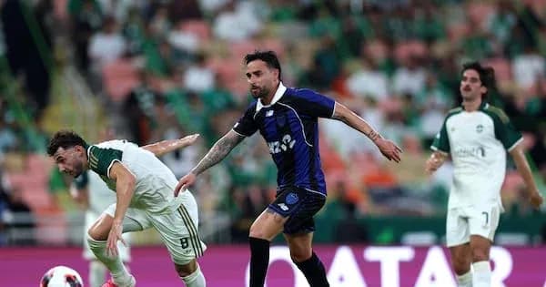 Player tackling opponent during football match