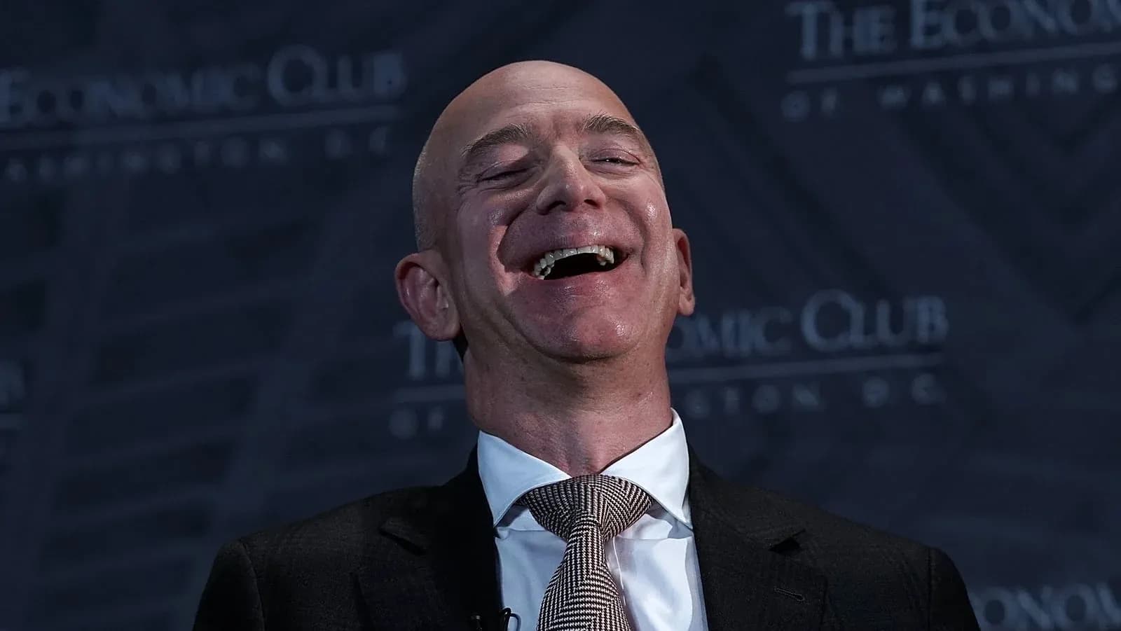 Speaker laughing at Economic Club event in Washington