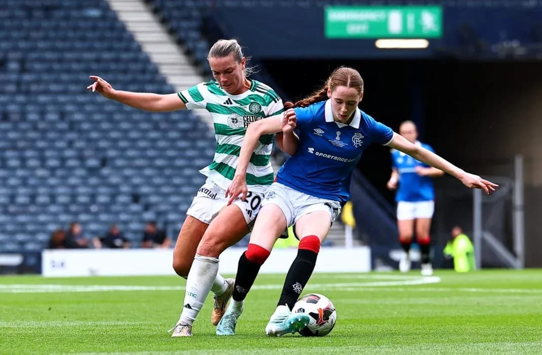 Celtic and Rangers players competing for the ball