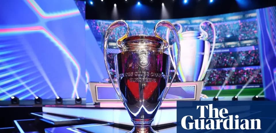Champions League trophy displayed on stage