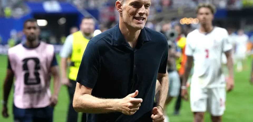 Coach running on the pitch after the match