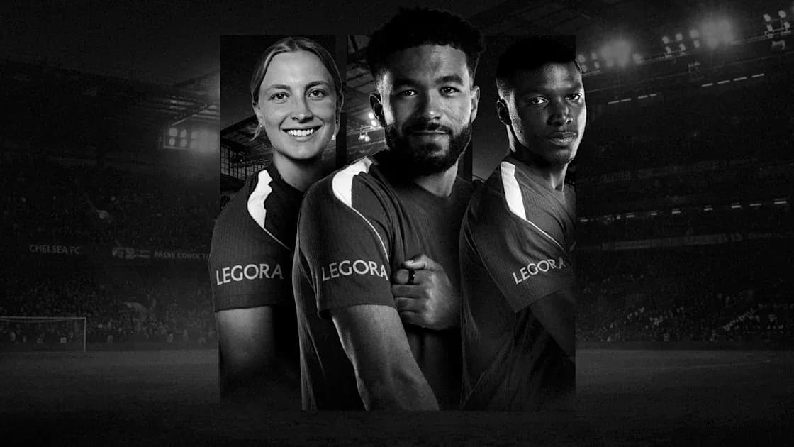 Chelsea FC players posing in team jerseys