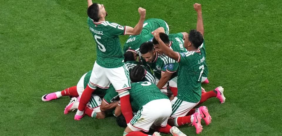 Mexican players celebrating a goal on the field