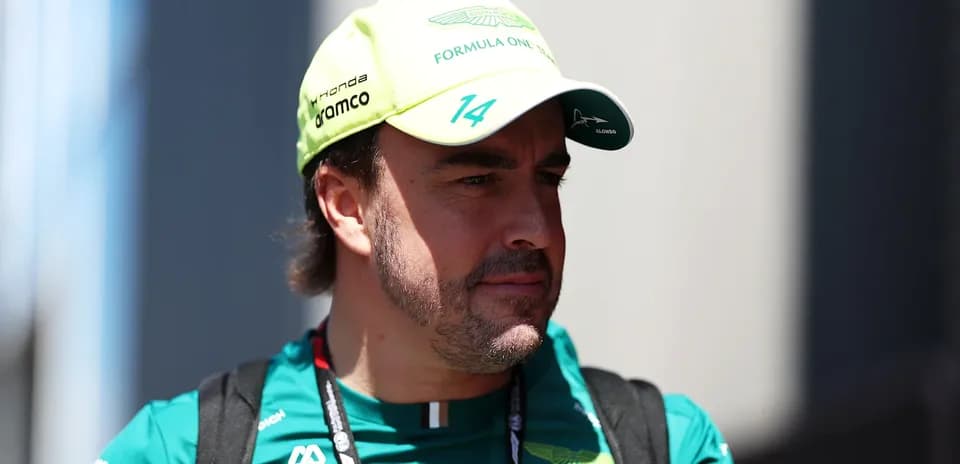 Formula 1 driver in Aston Martin team cap