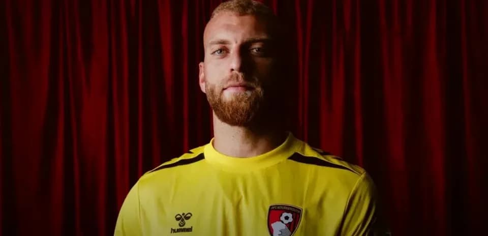Porter wearing AFC Bournemouth goalkeeper jersey