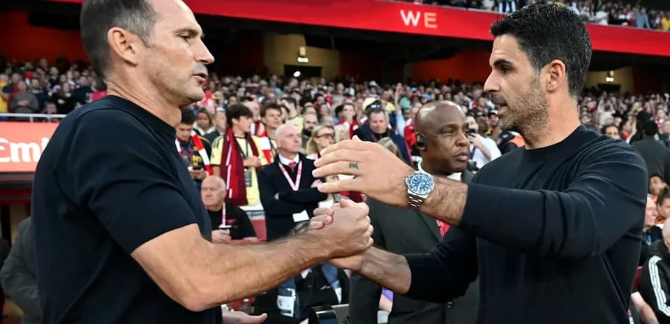Trainers shaking hands before the match at stadium