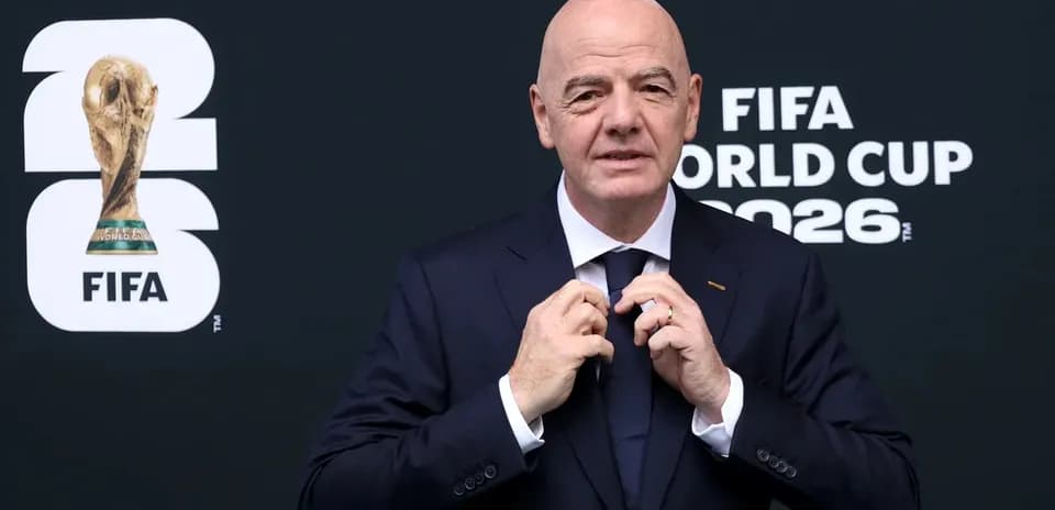 FIFA President adjusting tie at World Cup event