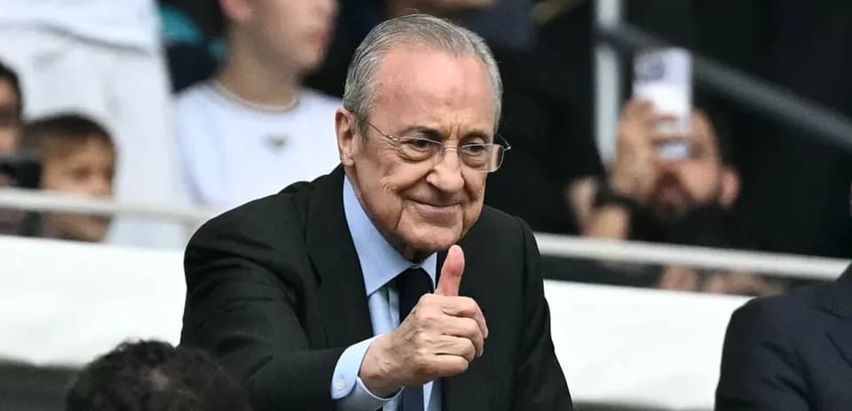 Person giving thumbs up in stadium crowd