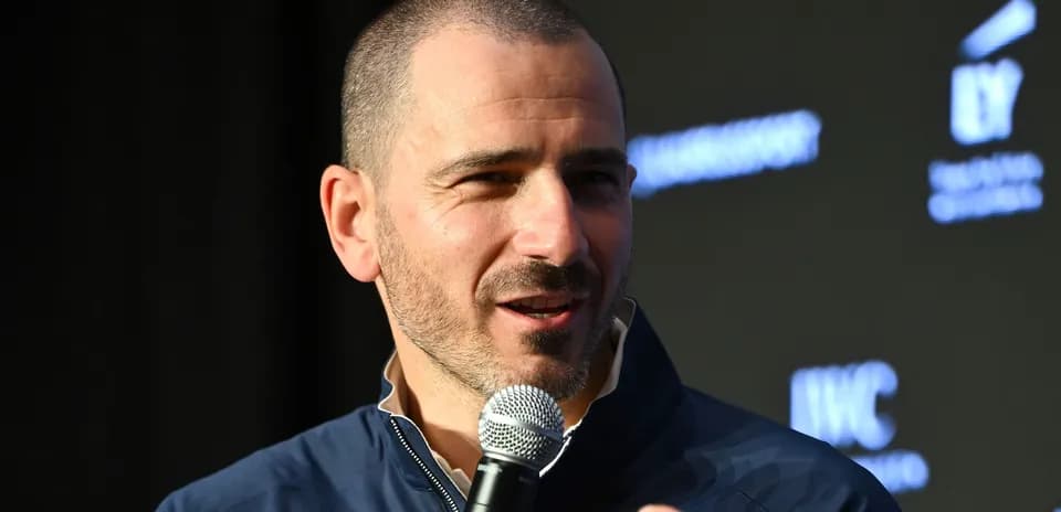 Speaker holding microphone at event presentation