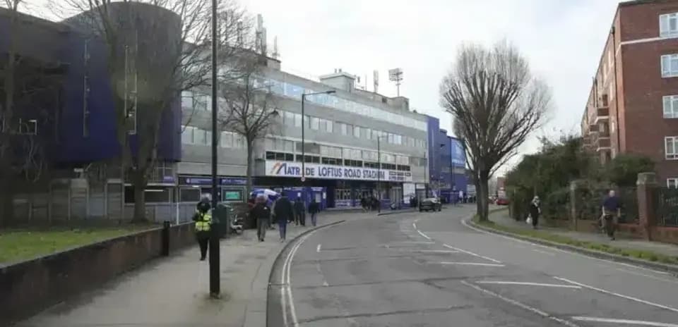 Loftus Road Stadium exterior with people walking
