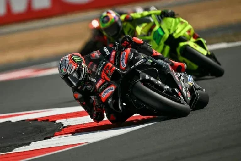 Motocross riders racing on a curved track