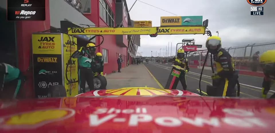 Pit stop during a Supercar race with team members